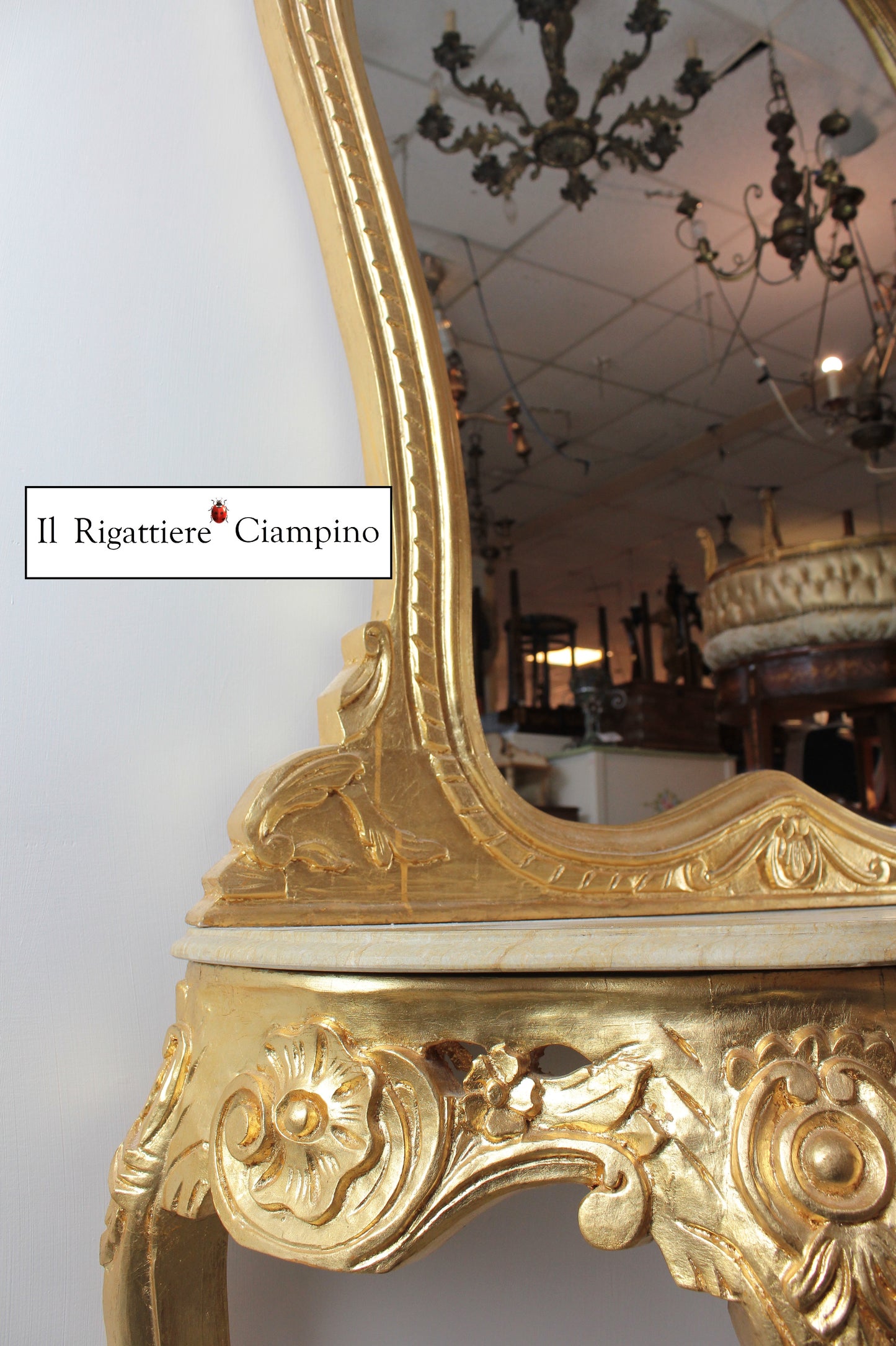 Consolle barocca in foglia oro con marmo champagne