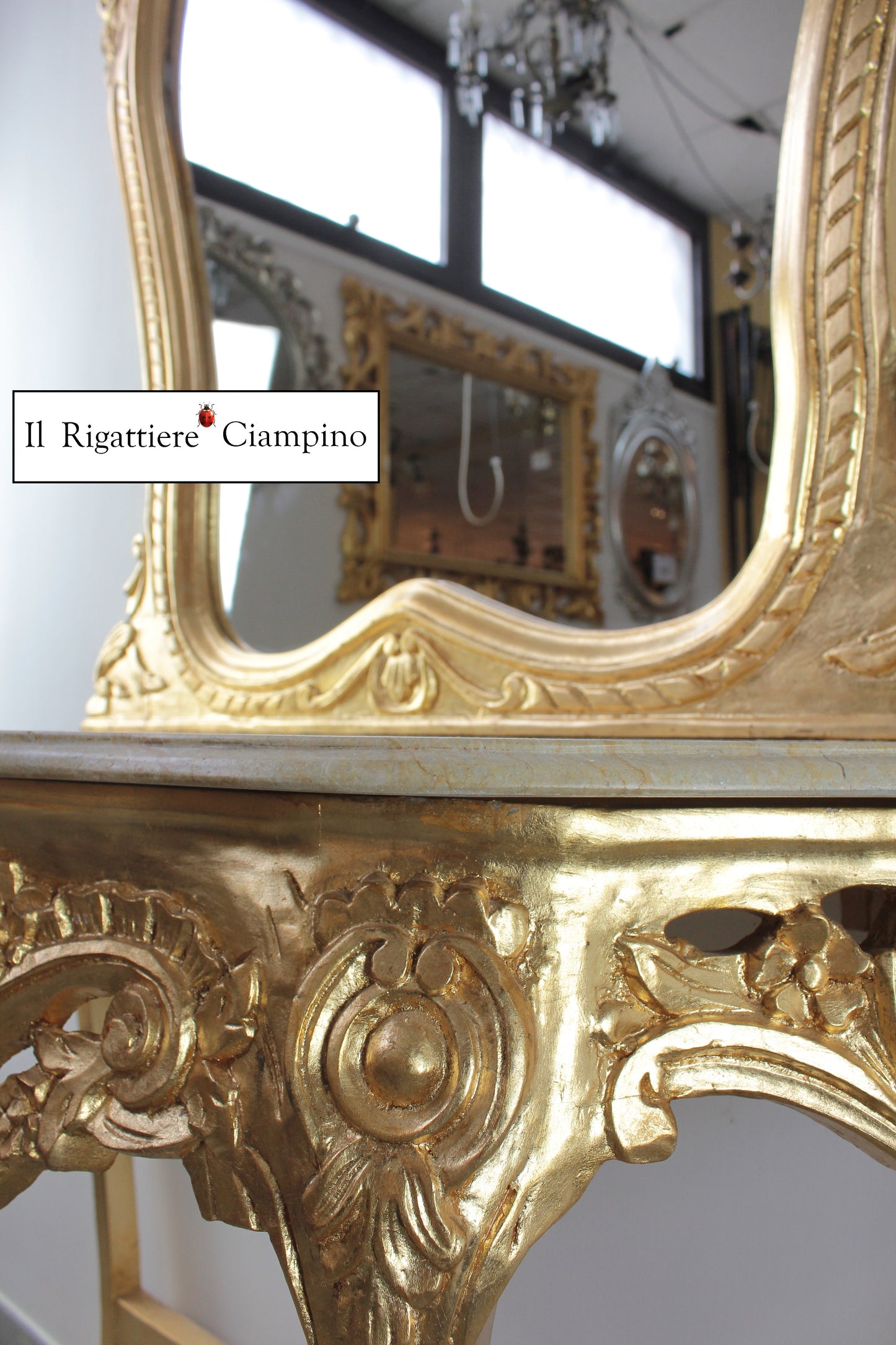 Consolle barocca in foglia oro con marmo champagne