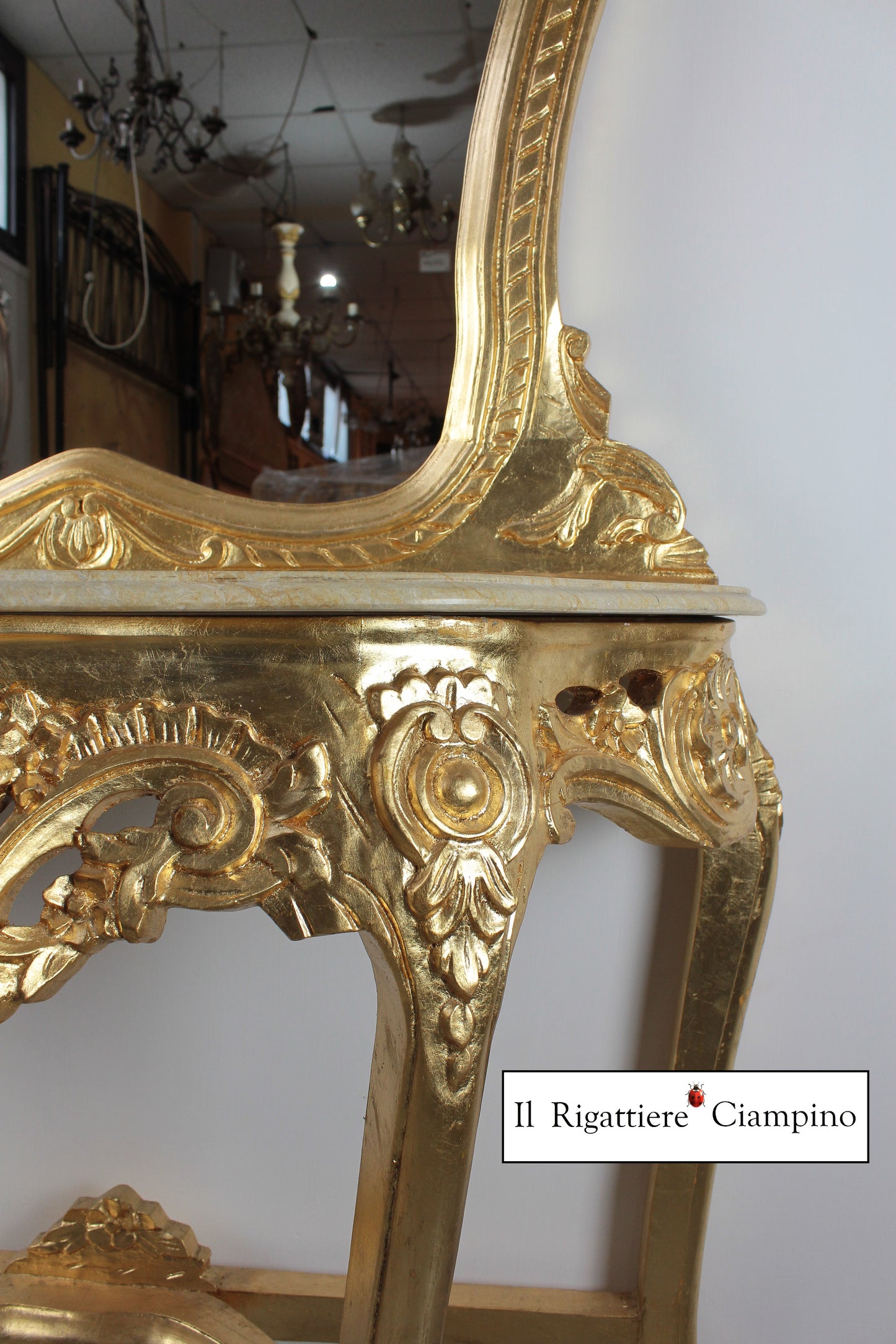 Consolle barocca in foglia oro con marmo champagne