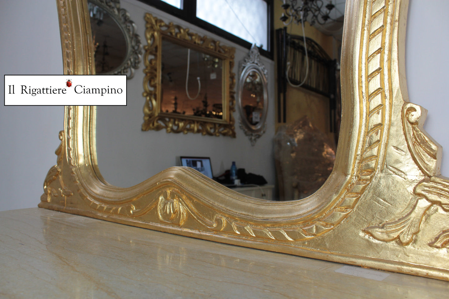 Consolle barocca in foglia oro con marmo champagne