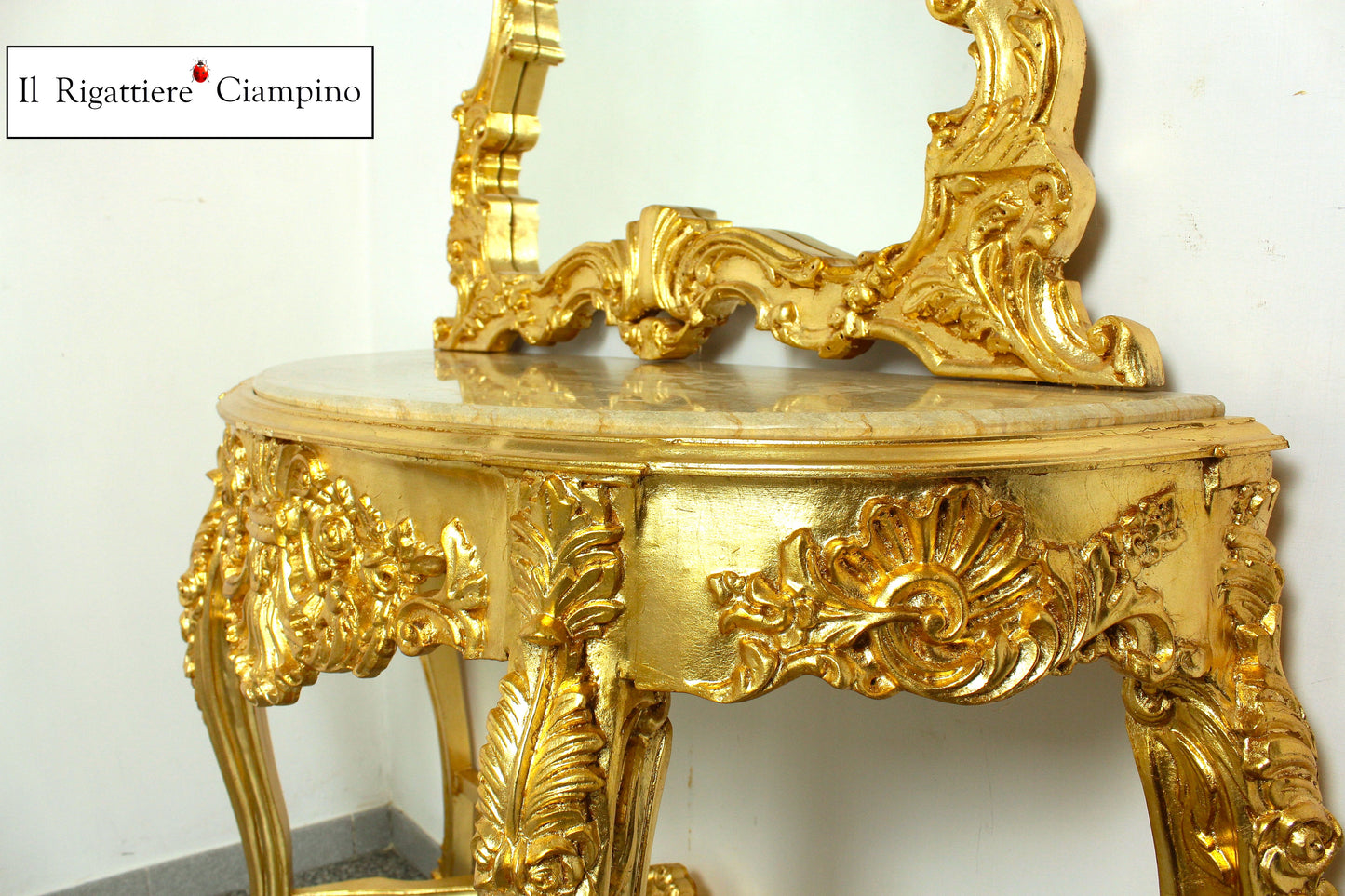 Consolle barocca in foglia oro con piano incastonato in marmo