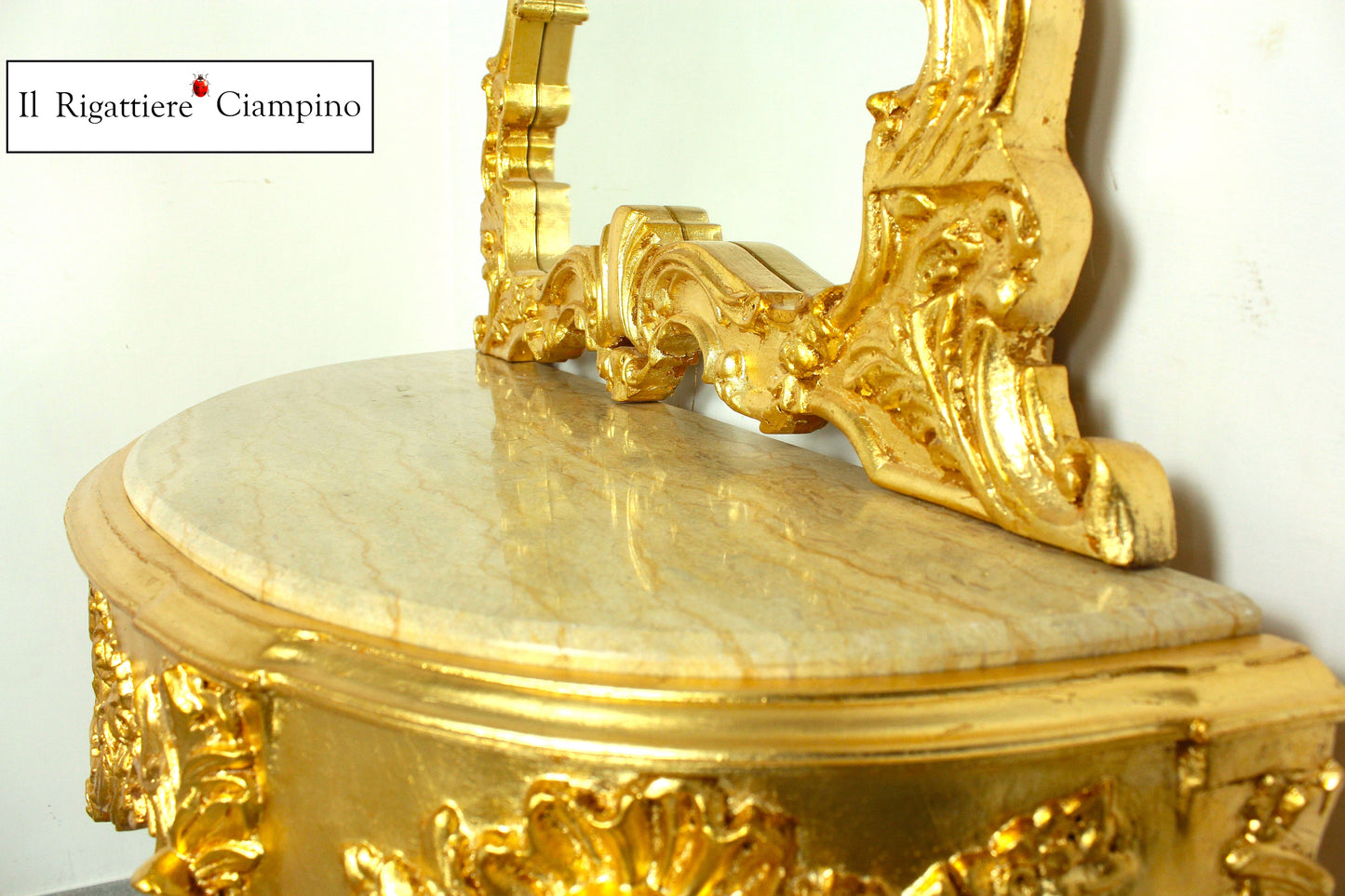 Consolle barocca in foglia oro con piano incastonato in marmo