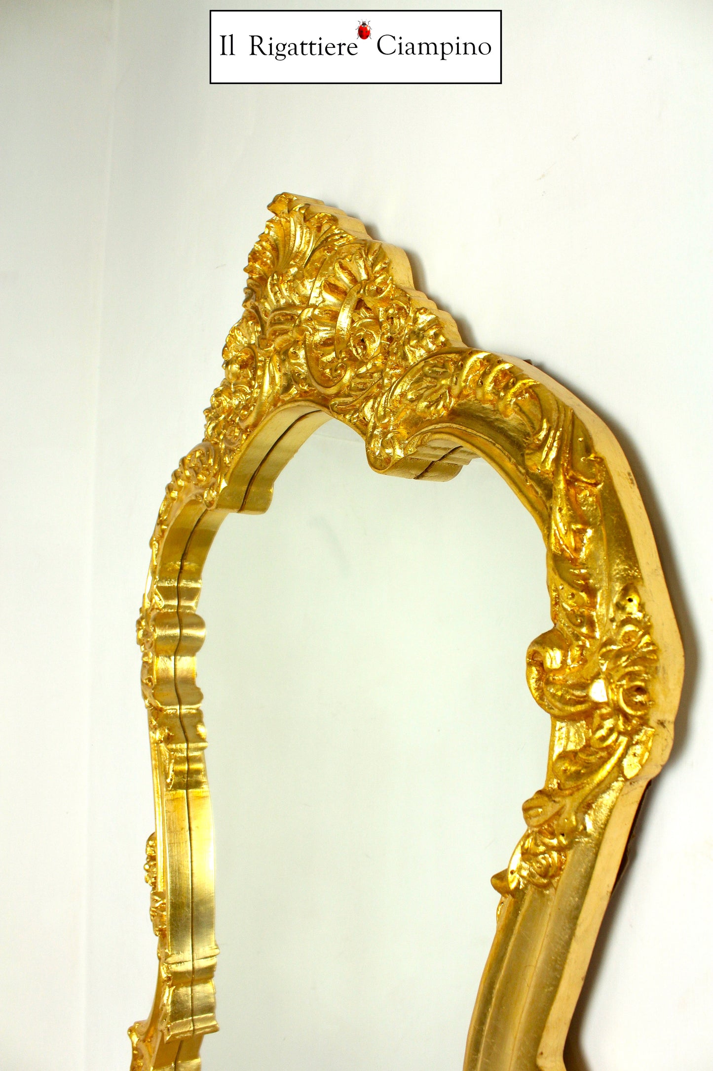 Consolle barocca in foglia oro con piano incastonato in marmo