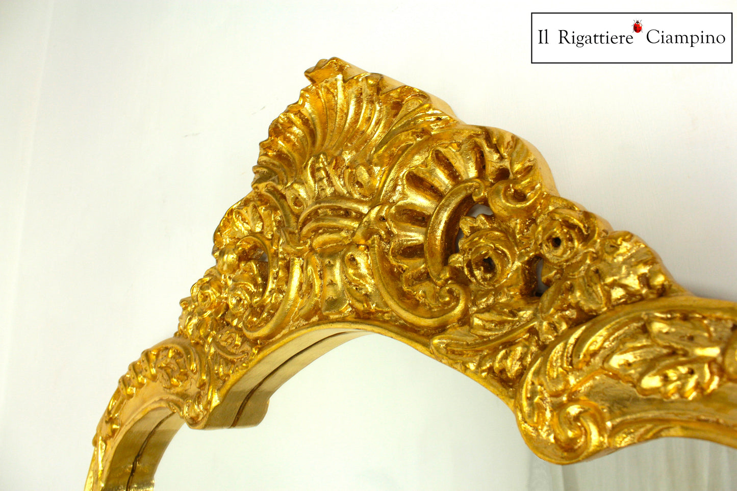 Consolle barocca in foglia oro con piano incastonato in marmo